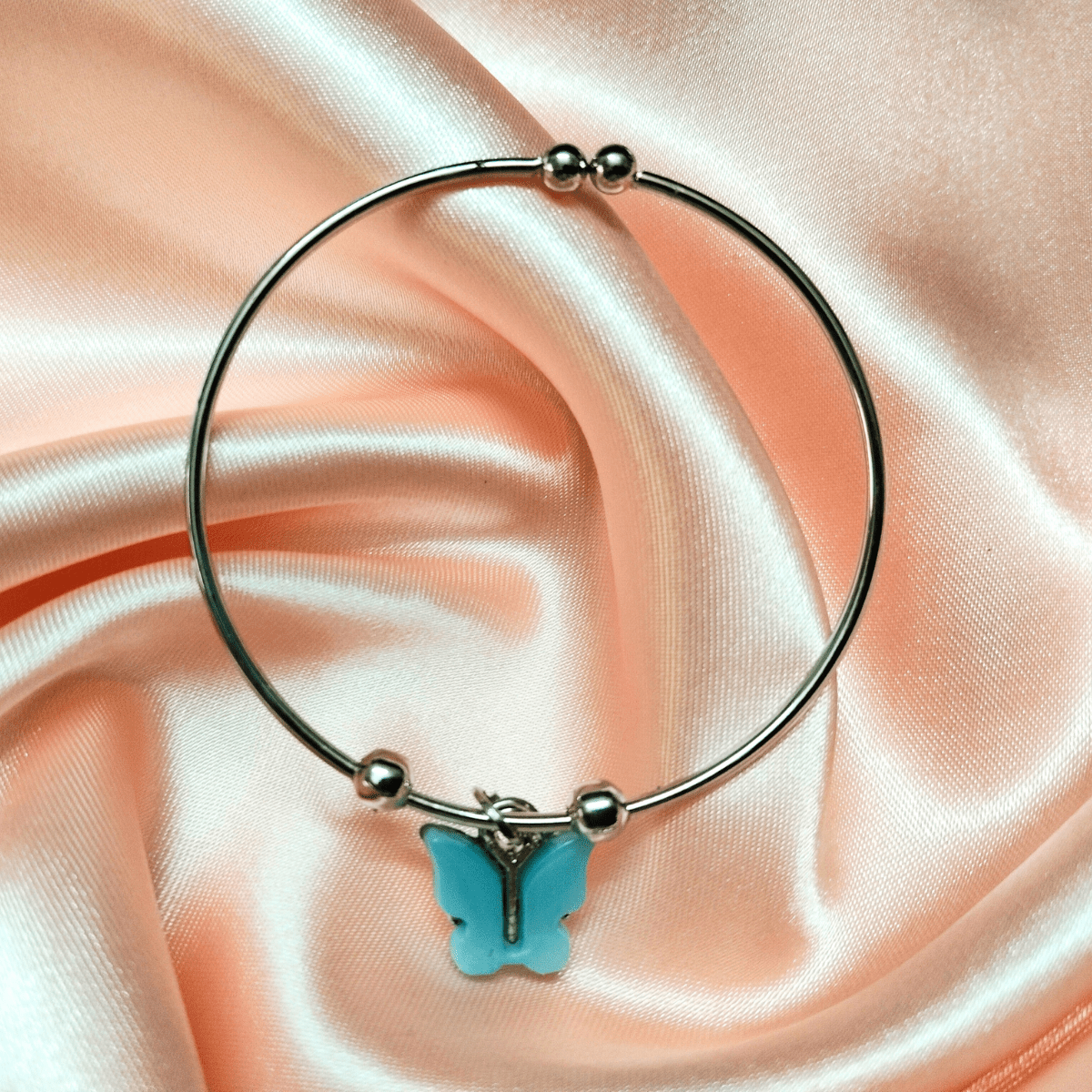 Bangle-bracelets-1-1.png Bangle Bracelet with Blue Butterfly Charm - Image 1