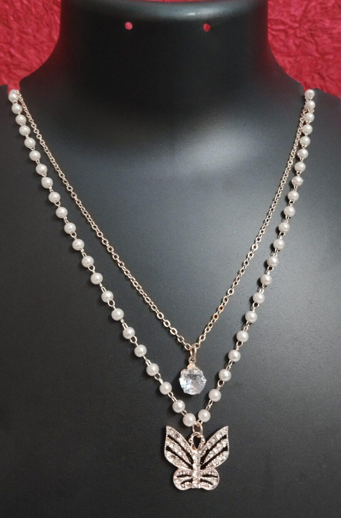 DSC005-scaled-e1742817312152.jpg Elegant Double-Layered Pearl & Butterfly Pendant Necklace - Image 1
