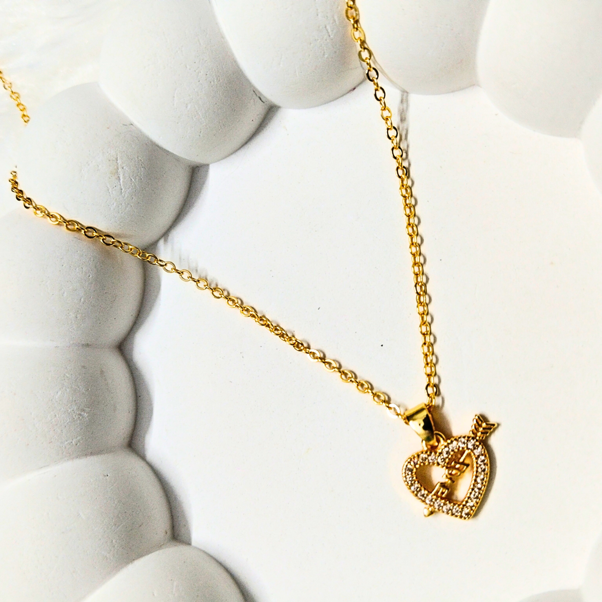 Love-ChainFlower-F-e1745566174398.png Gold Heart Pendant Love Necklace with Arrow and Crystals - Image 1