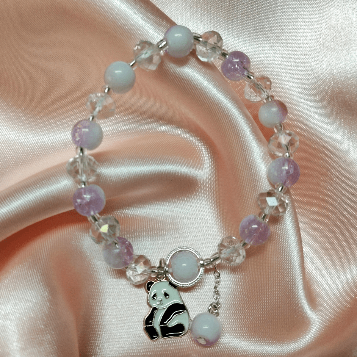 Purple-2.png Chic Purple and Crystal Beaded Bracelet with Adorable Teddy Bear Charm - Image 1
